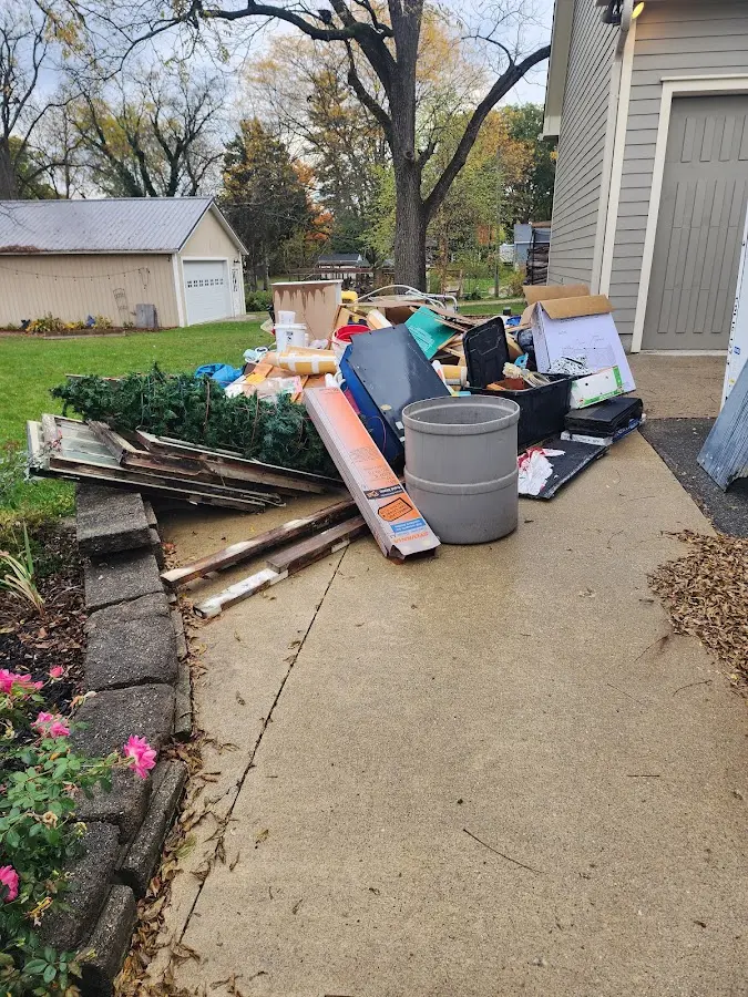 Dumpster being loaded with debris for Demolition Dumpster Rental in North Greenbush